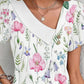 Dámské tričko s krátkým rukávem a asymetrickým límečkem s květinovým potiskem